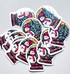 Stickers de Noël à reflets holographiques représentant un bonhomme de neige et un sapin enneigé dans une boule à neige.
