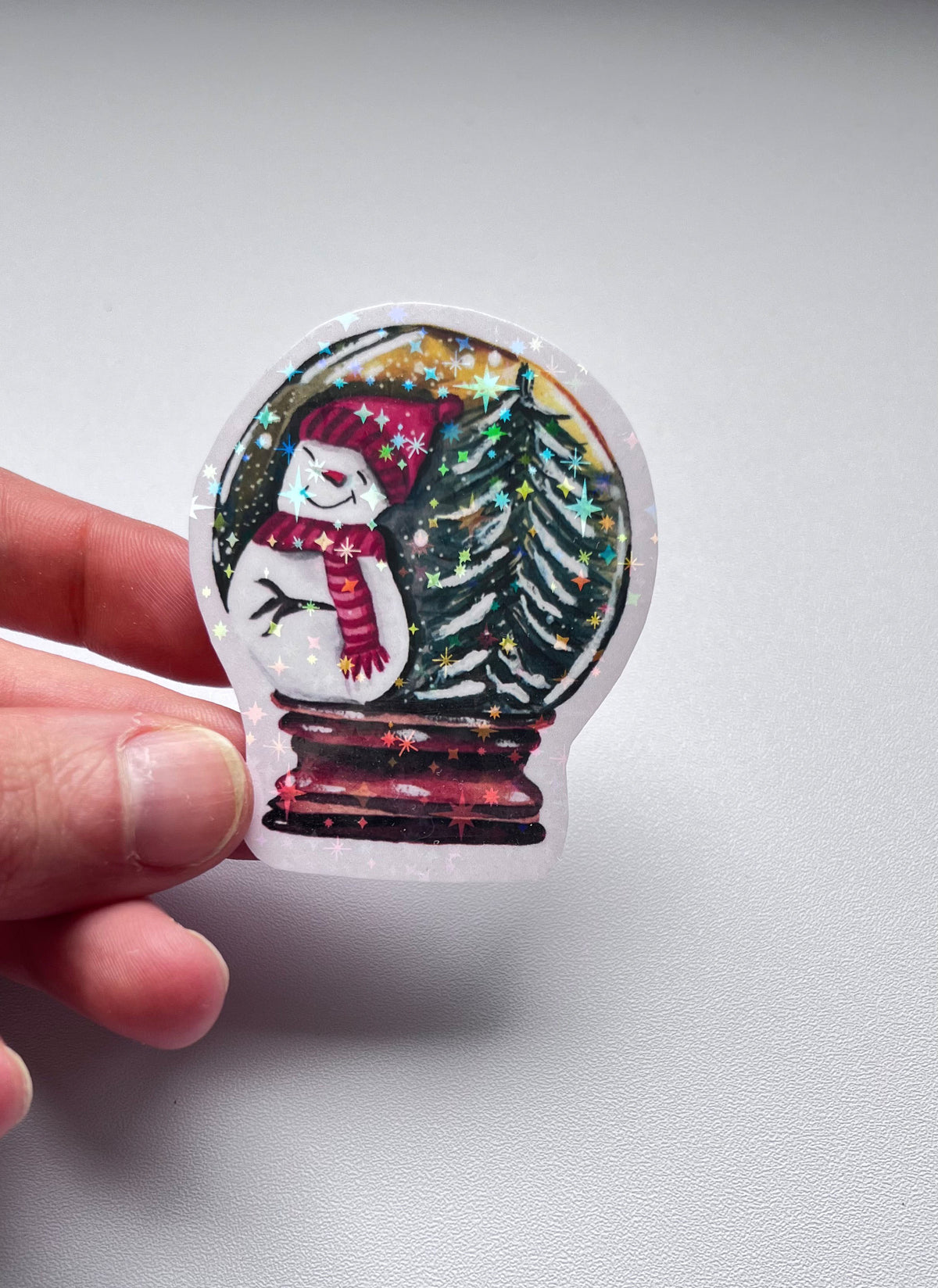 Sticker de Noël holographique – Boule à neige et bonhomme de neige
